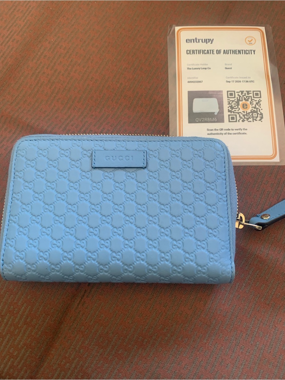 Entry blue embossed leather zip card holder